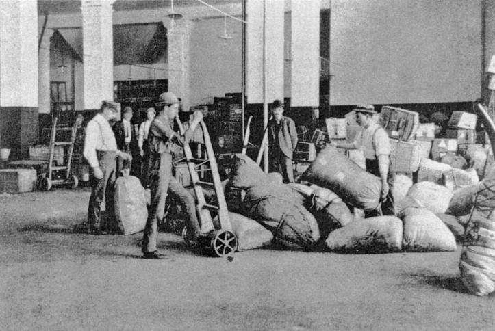 Peter Mac (white shirt, on the right) in the luggage room